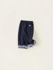 Girls' navy blue cotton casual pants with cute blue checkered ruffled hem detailing