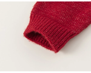 Close-up of bright red knitted sweater cuff with ribbed edge detail for girls