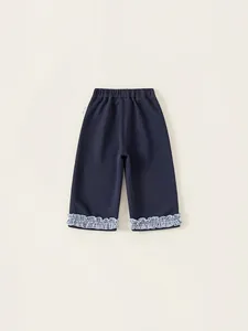 Navy blue girls casual cotton trousers with ruffled plaid hem and elastic waistband