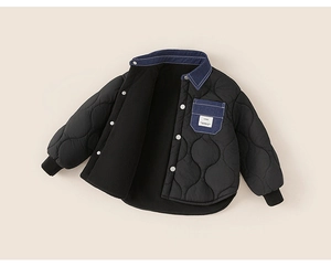 Detail of boys winter quilted jacket with warm fleece lining and denim contrast collar