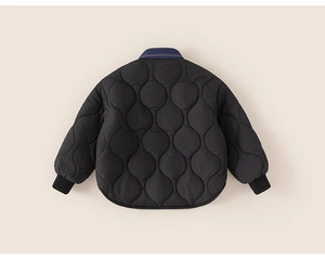 Detail of children's wavy quilted jacket showing denim collar and ribbed windproof cuffs