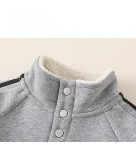 Close-up of boys gray standing collar sweatshirt with warm white sherpa fleece lining