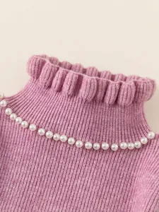 Pink girls knitted dress with pearl mock neck and ruffled collar detail