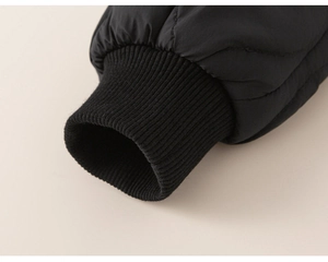 Detail of windproof elastic ribbed cuffs on a quilted winter coat for boys