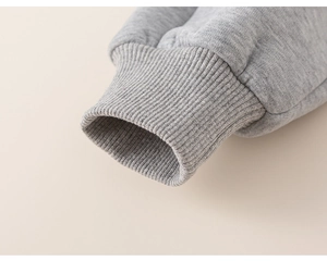 Close-up of grey sweatshirt ribbed cuffs and premium thick fleece cotton fabric detail