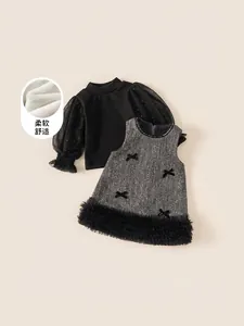 Winter girls' two-piece set featuring mesh sleeve top and tweed dress with bow accents