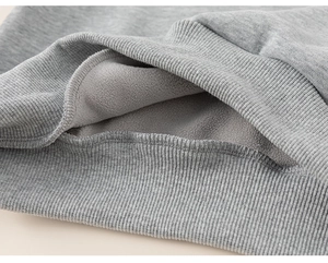 Detail of the warm fleece lining and ribbed cuff on this grey boy's winter sweatshirt
