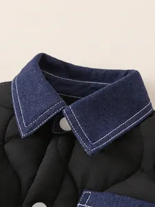 Quilted boys winter jacket with navy denim collar and white buttons detail