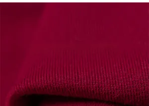Detailed close-up of dark red thick ribbed knit fabric for girls winter princess dress