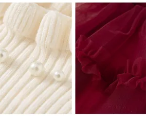 Close-up of white knit fabric with pearl accents and pleated dark red mesh details