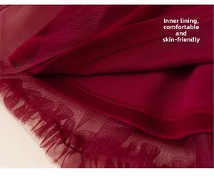 Detail view of burgundy tulle girl dress with dual-layer fabric and soft inner lining