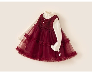 Detail of red mesh tutu dress with tweed bodice, sequins, and velvet bows for girls