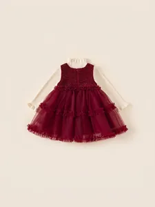 Winter girls two-piece set featuring cream knit sweater and burgundy layered tulle dress
