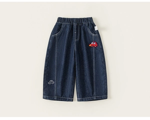 Detail of kids dark blue wide leg jeans with elastic waist and red toy car patch