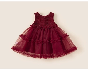 Detail view of wine red sleeveless baby dress with tweed bodice and layered tulle skirt