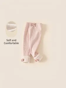Roze fleecegevoerde peuterlegging met strik en sherpa-afwerking voor winterse warmte