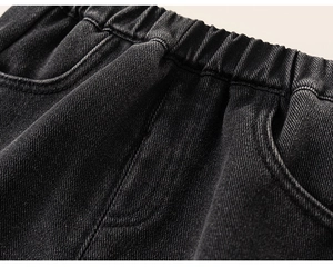 Detail of girls denim pants showing the elastic waistband and high-quality stitching