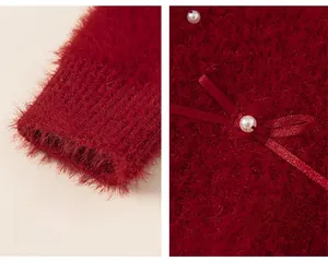 Detail of red plush sweater with elastic cuffs and bow decoration with pearl accent