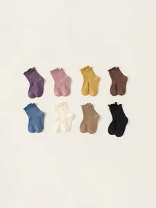 Eight pairs of colorful cotton crew socks with ruffled edges for girls and kids