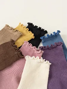Colorful pack of ribbed cotton crew socks for girls featuring stylish lettuce edge ruffles