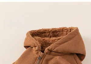 Macro detail of kids winter jacket with warm faux shearling lining and bronze zipper