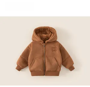Detail of brown fleece-lined winter hoodie with BO BO embroidery and zipper closure