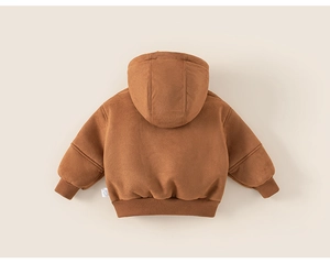 Detail of warm brown hooded winter coat with ribbed cuffs and soft fleece texture
