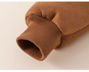 Close-up of warm brown fleece jacket sleeve with thick ribbed knit elastic cuffs
