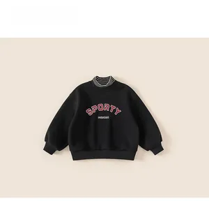 Close-up of black kids sporty sweatshirt with striped mock neck and letter print