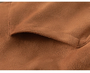 Close-up detail of dark brown suede fabric with pocket stitching for children's winter coat
