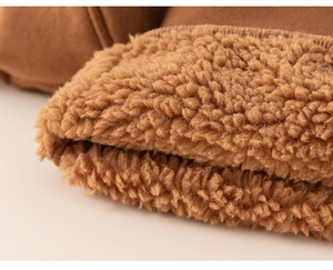 Close-up of winter kids jacket showing warm sherpa lining and brown jersey fabric texture