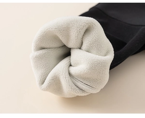 Detailed macro view of heavy white fleece lining inside a premium black thermal sweatshirt