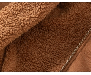 Detail of brown suede kids coat with thick sherpa lining and side zipper texture