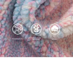 Detail of pink and blue rainbow coral fleece fabric showing soft texture and skin-friendly fibers