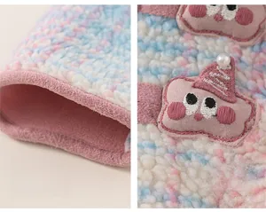 Close-up of girls rainbow fleece jacket showing soft cuffs and cute animal embroidery