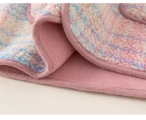 Detail of soft rainbow fleece fabric and loose hem on this warm hooded girls coat