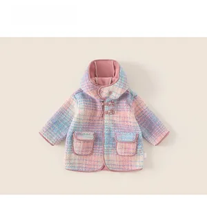 Detail of colorful hooded fleece coat showing texture, front pockets, and button closure