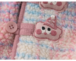 Detail of soft rainbow fleece jacket with pink button and cute cartoon cloud embroidery