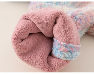 Macro shot of plush rainbow fleece fabric and warm pink flannel lining on kids winter coat