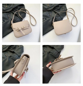 Detailansicht beige Satteltasche mit Schnallenriemen, Goldbeschlägen und Lederstruktur