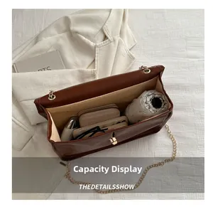 Detailed interior view showing large storage capacity for umbrella, wallet, and phone