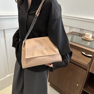 Minimalist beige shoulder bag with butterfly embroidery and metal chain strap for women
