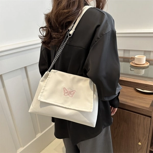 Minimalist beige shoulder bag with pink butterfly embroidery and chain strap for women