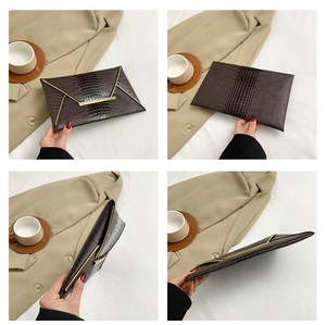 Detailed views of dark brown crocodile pattern envelope clutch with gold metal trim