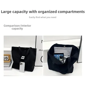 Large black canvas tote bag showing interior compartments with tablet and daily essentials