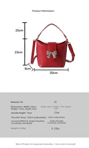 Detail view of red PU leather butterfly bag with dimensions 20x15x8cm and silver metal bow