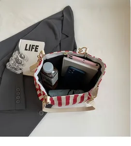 Vertical striped tote bag interior showcasing spacious capacity for daily essentials