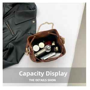 Top view of brown leather bucket bag showing large interior capacity for daily items