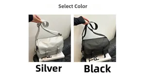 Detail view of large waterproof nylon messenger bags in silver and black colors
