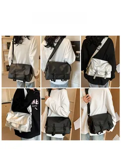 Detail shots of large nylon messenger bag with buckle closures in black and silver